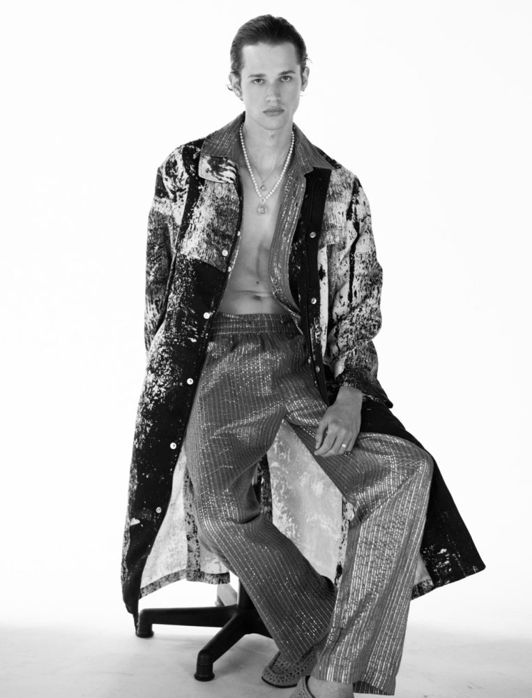 male model Charlie Nolte shot by Beau nelson in a textured outfit sitting jeans